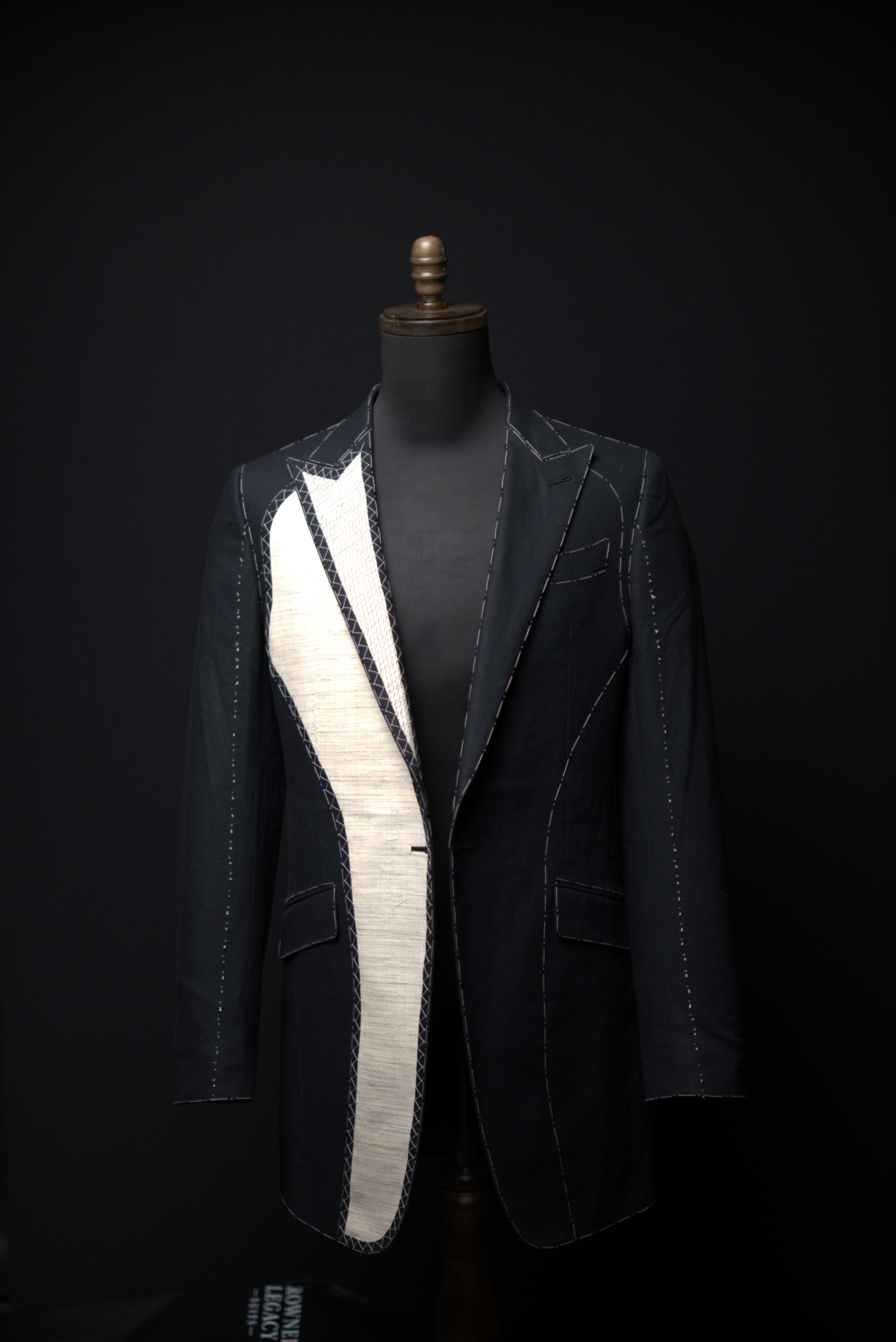 Work-in-progress jacket · white basting threads · canvas/lining exposed